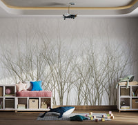 Abstract winter forest wall mural displaying grey tree silhouettes.