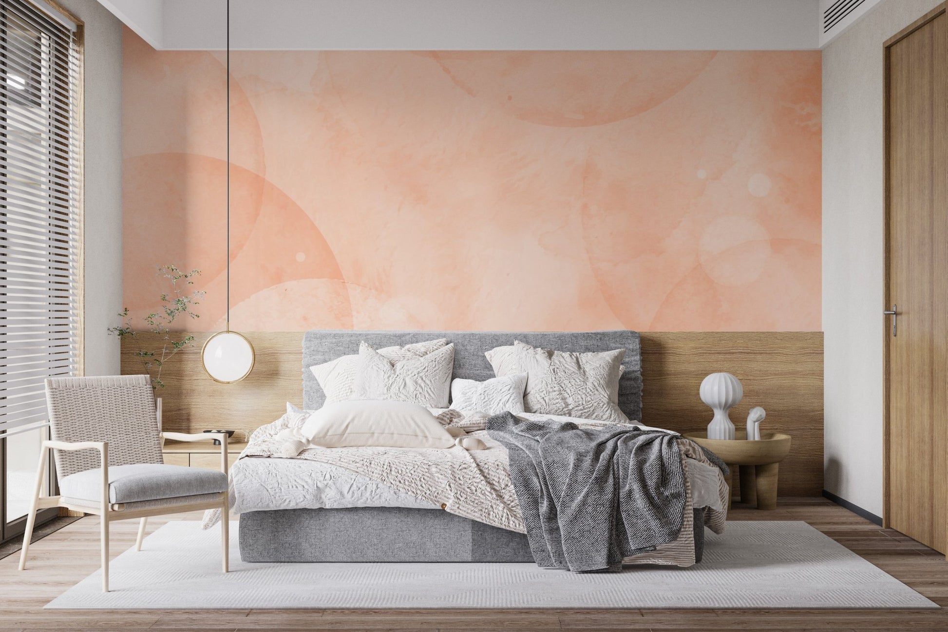 Minimal abstract mural in peach and cream with fluid circle pattern on bedroom walls.