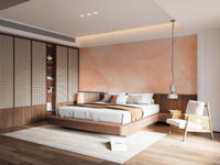 Soft peach wall mural featuring faded watercolor discs and light texture.