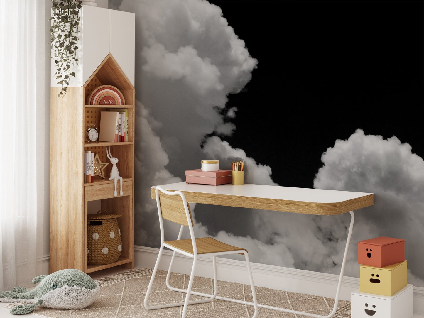 Kids' study desk with a white chair against a black and white cloud wall mural.