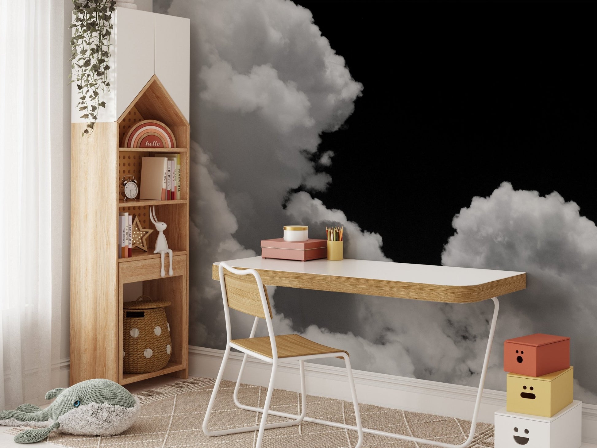 Kids' study desk with a white chair against a black and white cloud wall mural.