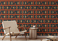 Ethnic pattern wallpaper in reading area featuring a mid-century armchair and side table.