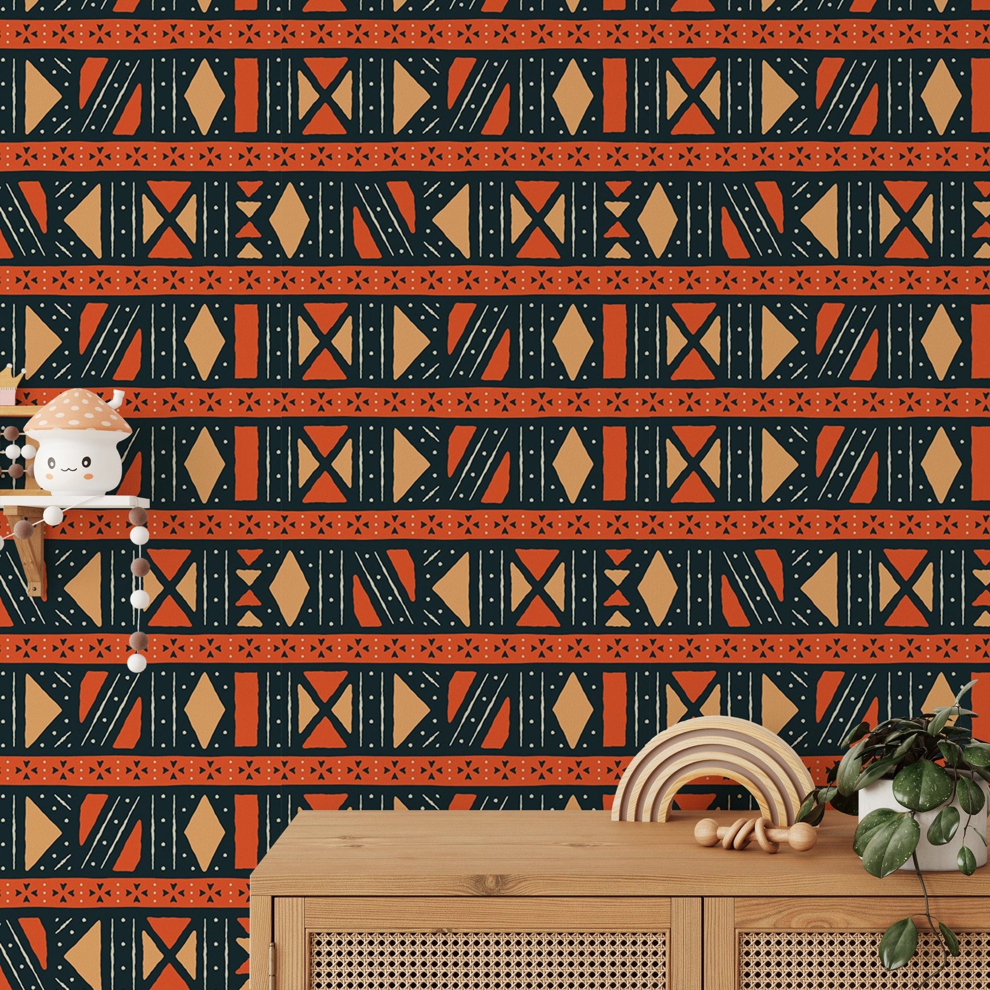 Patterned ethnic wallpaper behind a wooden console with small decor items.