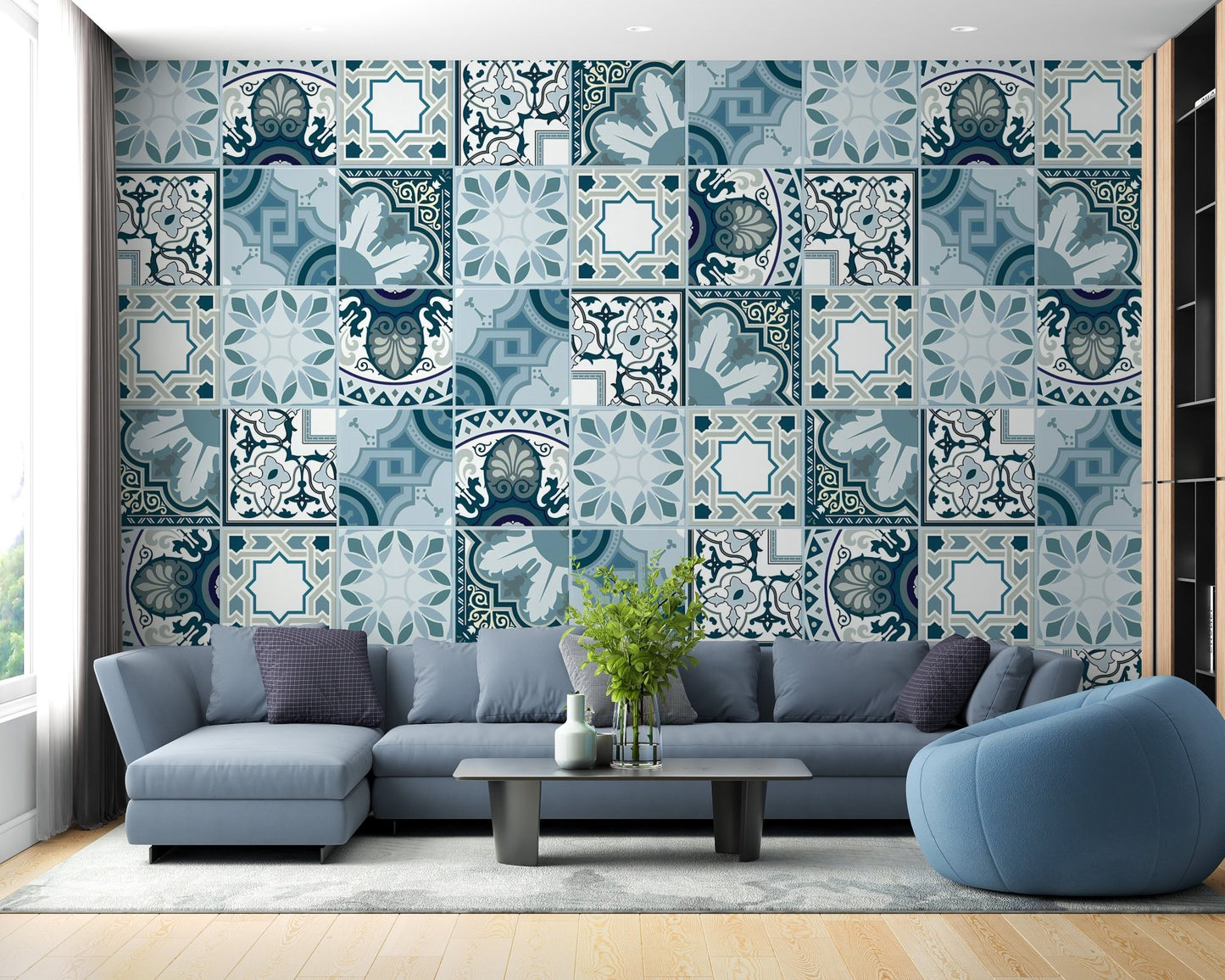 Blue mosaic tile wall mural behind an L-shaped sofa in a contemporary flat.