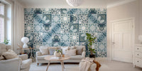 Blue and grey tile patterned wall mural behind a modern beige sofa.