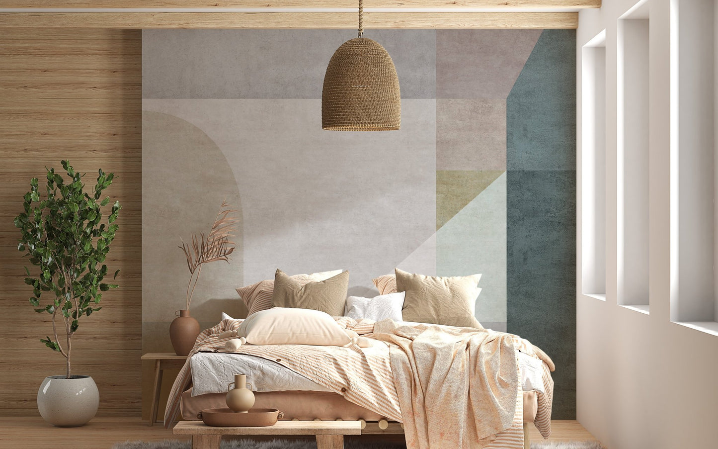 Soft pastel shapes abstract wall mural behind a wooden bed with beige bedding.