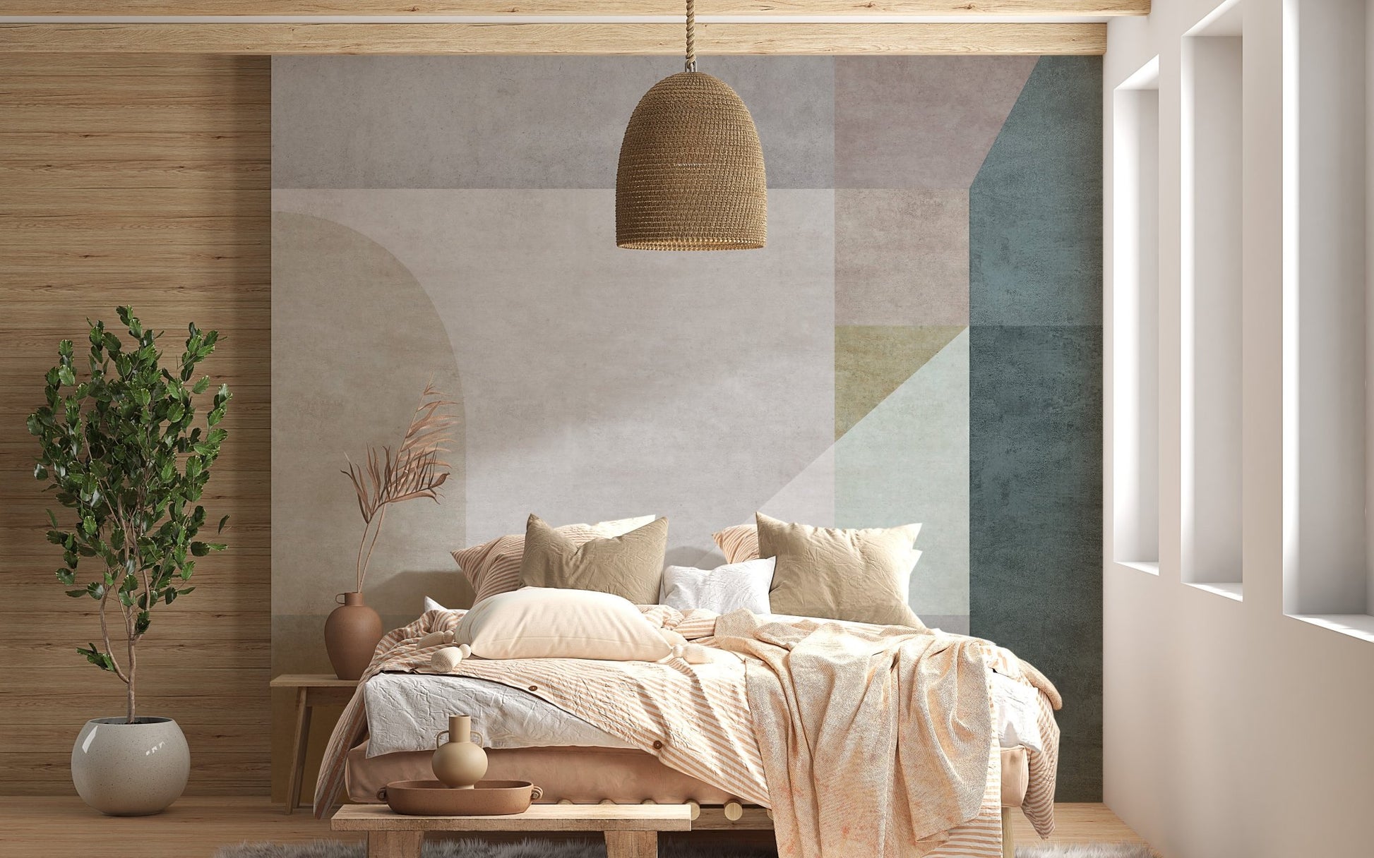 Soft pastel shapes abstract wall mural behind a wooden bed with beige bedding.