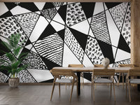 Monochrome geometric mural with bold patterns for dynamic spaces.
