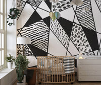 Modern wall mural showcasing black and white geometric patterns.
