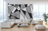Artistic mural featuring geometric black and white patterns.
