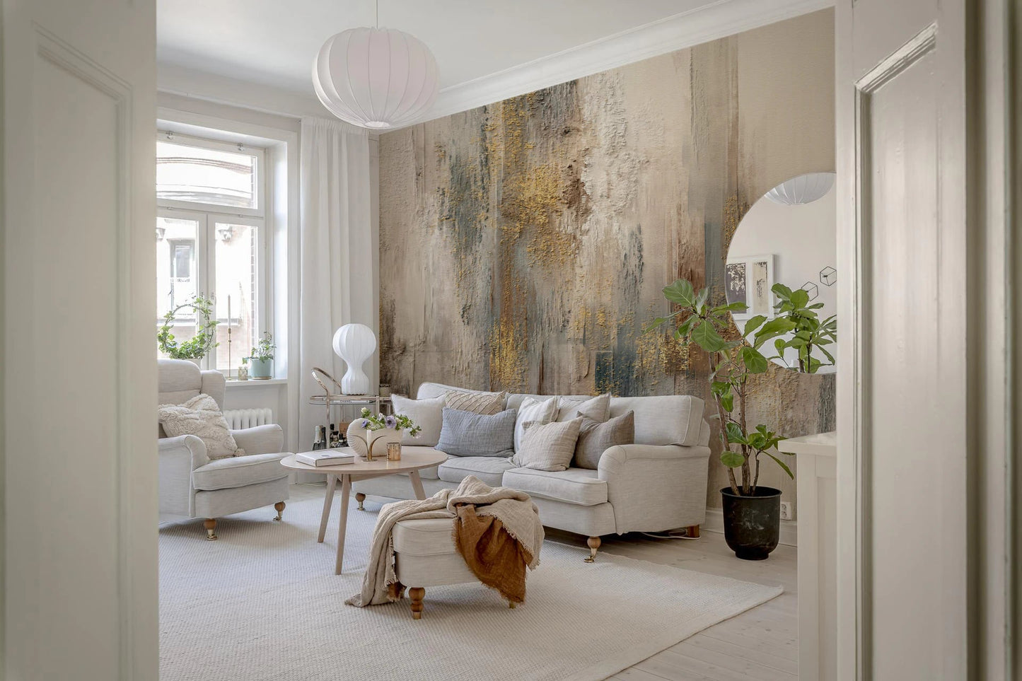 Modern living space with white sofas and glided abstract wall mural.