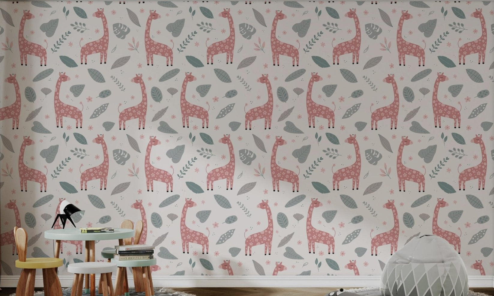Pink giraffe wallpaper with floral patterns and grey leaves on white.