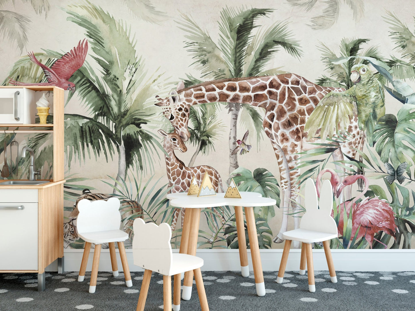 Tropical forest wall mural with tall giraffes and green palm leaves in a kids dining area.