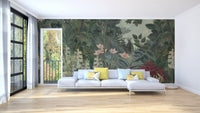 Tropical forest wall mural behind white sofa in bright modern living area