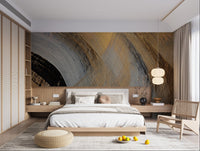 Gold and charcoal abstract wall mural with textured finish for bedroom interior.