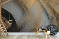 Bold gold and black abstract wall mural with fluid movement.