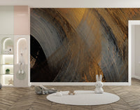 Modern gold swirl wall mural wallpaper in black and gray tones for nursery backdrop.