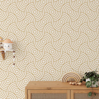 Wooden storage unit set against a gold wave stripe patterned wallpaper.