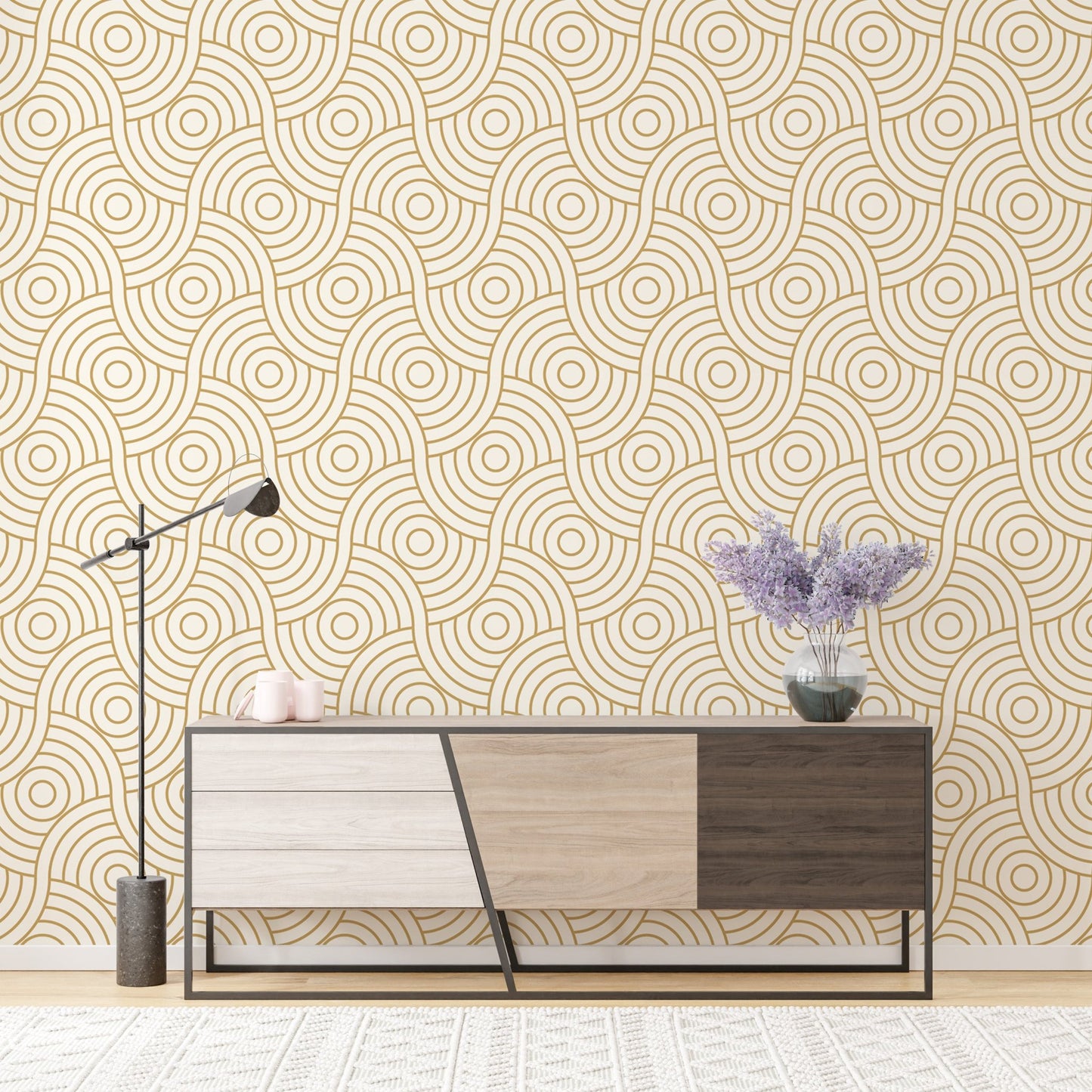 Abstract gold wave wallpaper mural behind a modern sideboard and desk lamp.