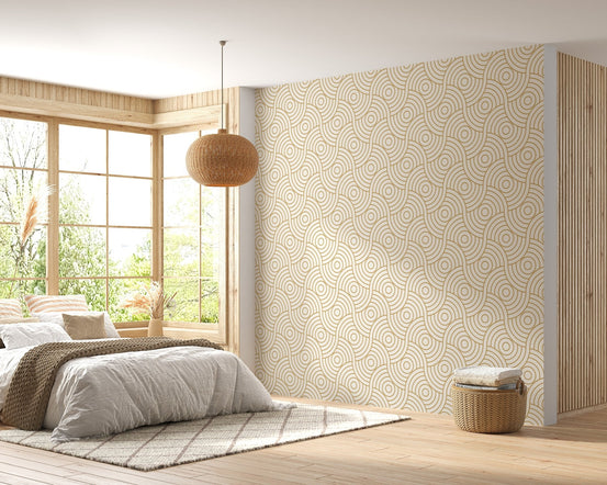 Bedroom featuring a large gold wave stripe wallpaper behind the bed.