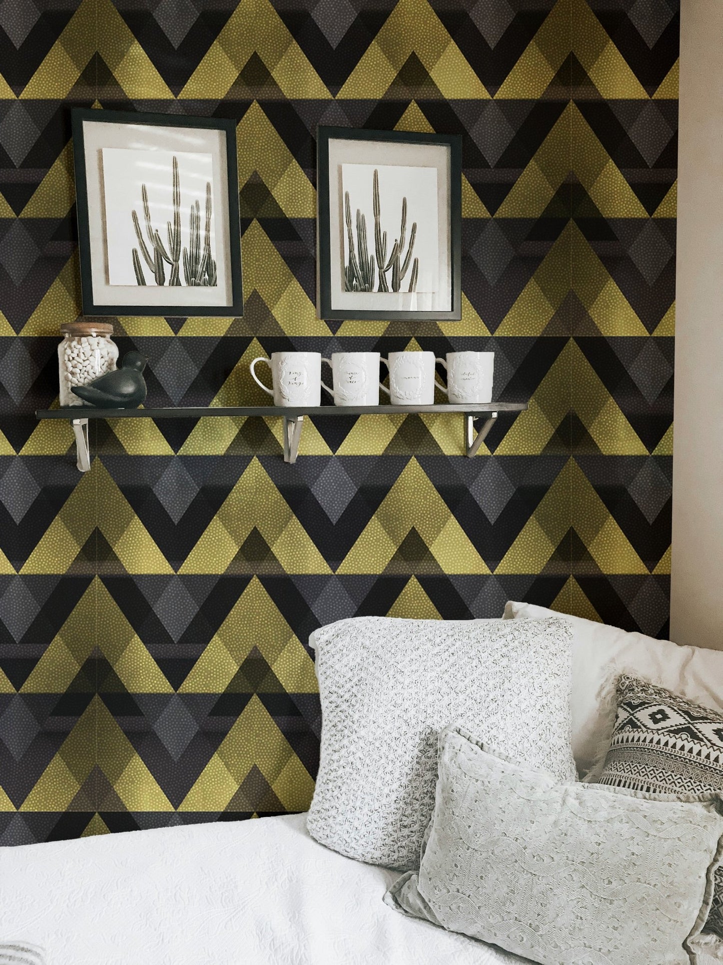 Living room wallpaper with gold geometric patterns and white sofa.
