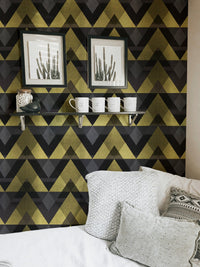 Living room wallpaper with gold geometric patterns and white sofa.
