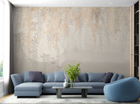 Golden and Grey Hanging Leaves Wall Mural in a living room with a blue sofa.