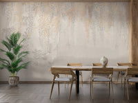 Dining room wall mural with grey leaves and a wooden dining set.