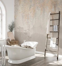 Bathroom wall mural featuring hanging leaves next to a freestanding white bathtub.
