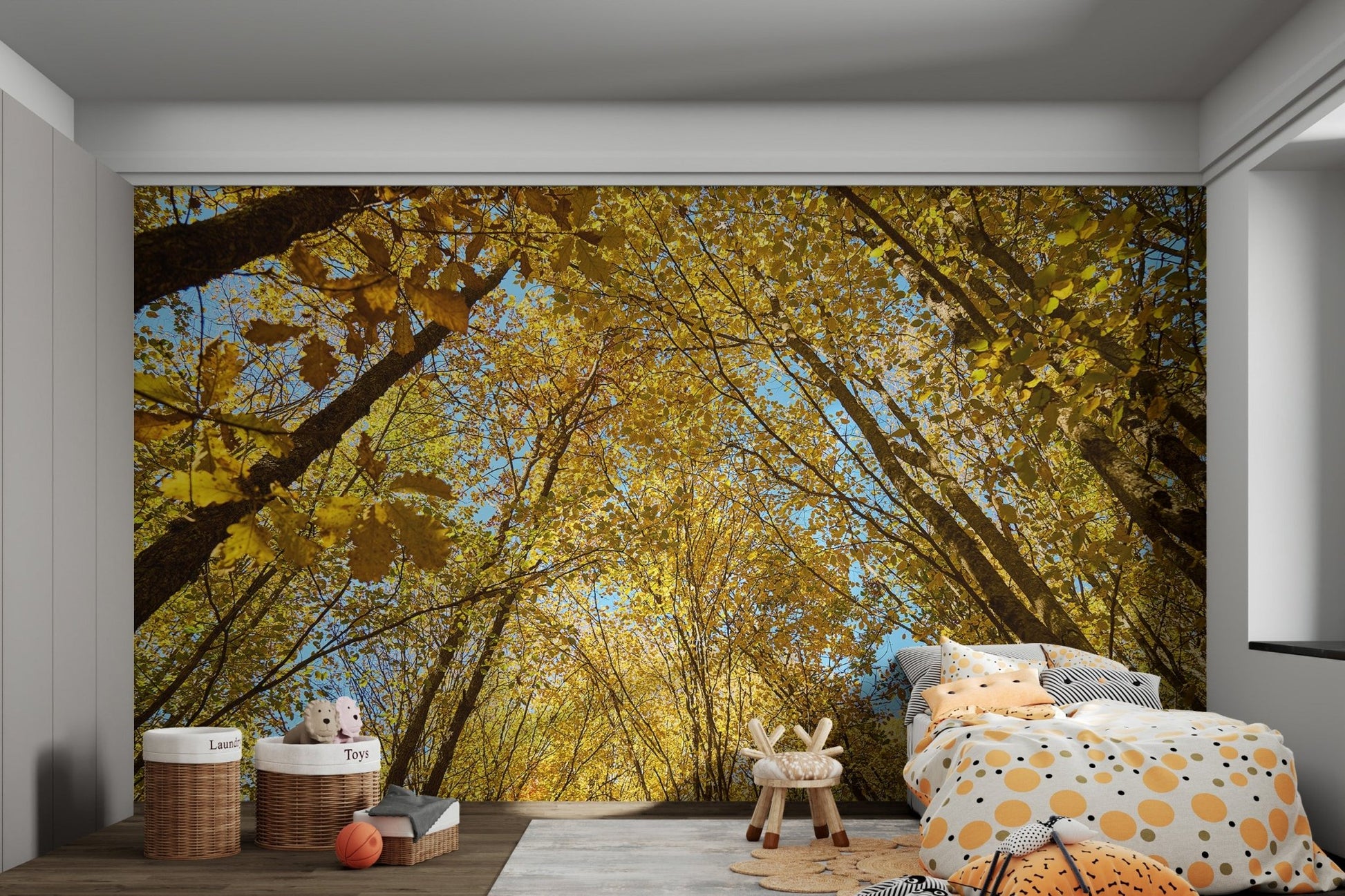 Dense autumnal forest ceiling with bright sky wall mural.
