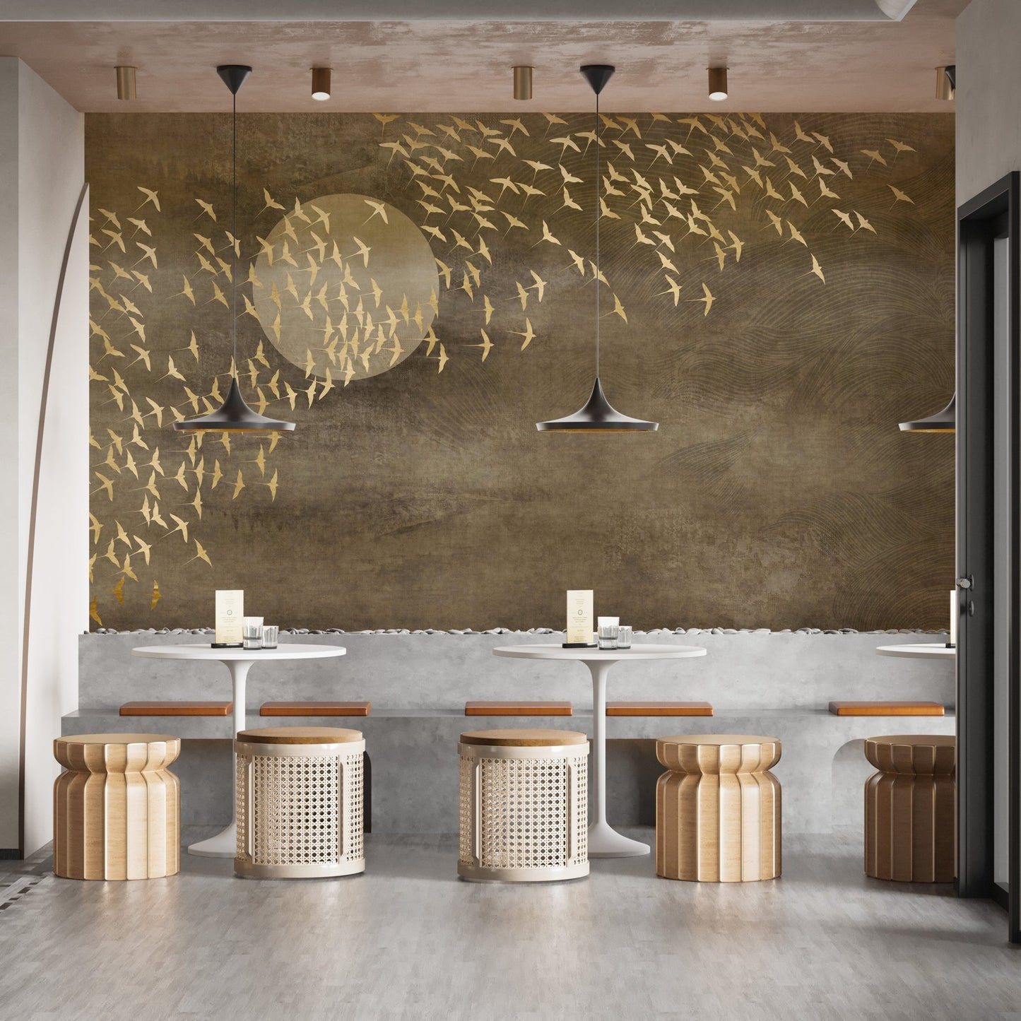 Cafe interior featuring golden birds flying in sky mural on a feature wall.