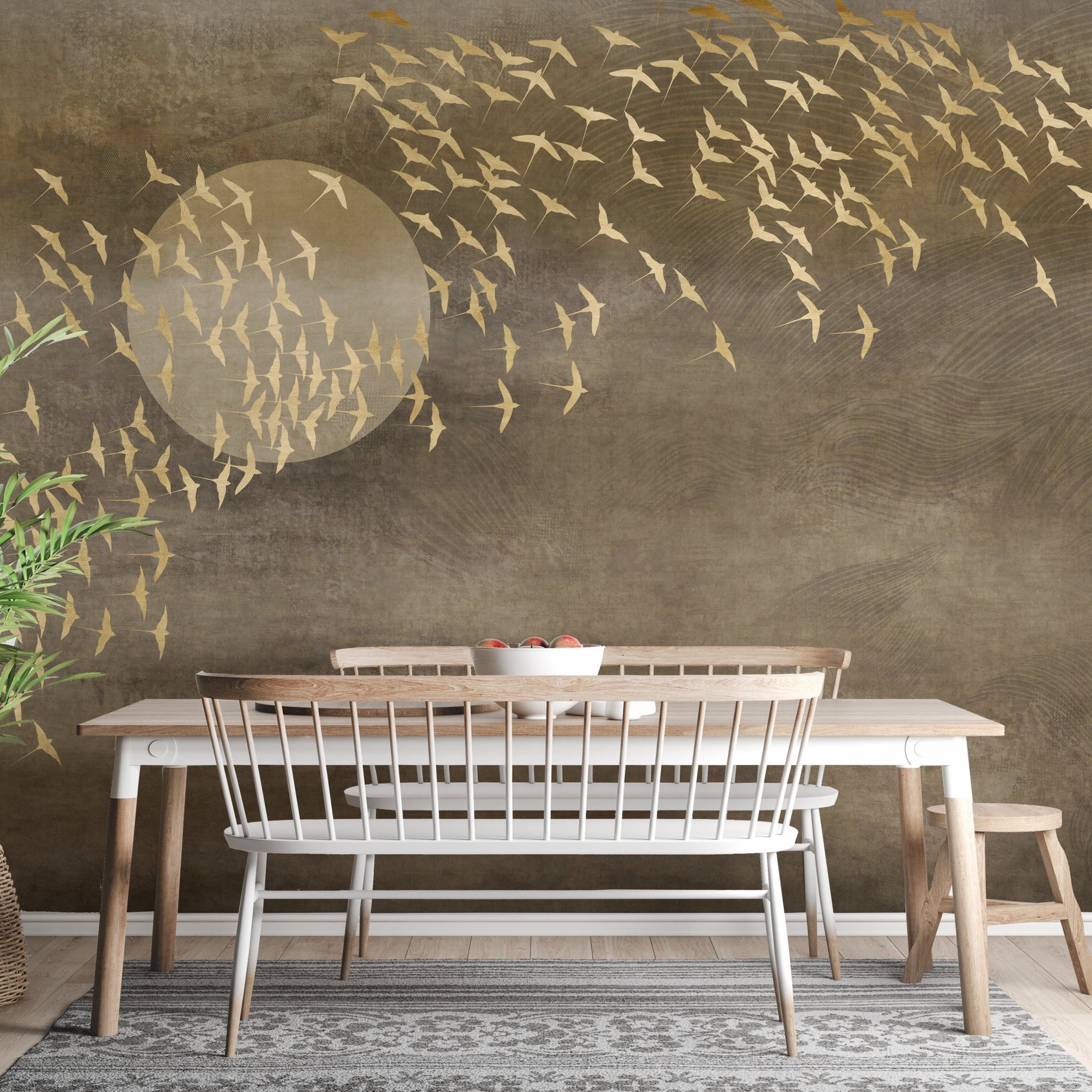 Golden birds wall mural installed in a dining room with wooden table and bench.