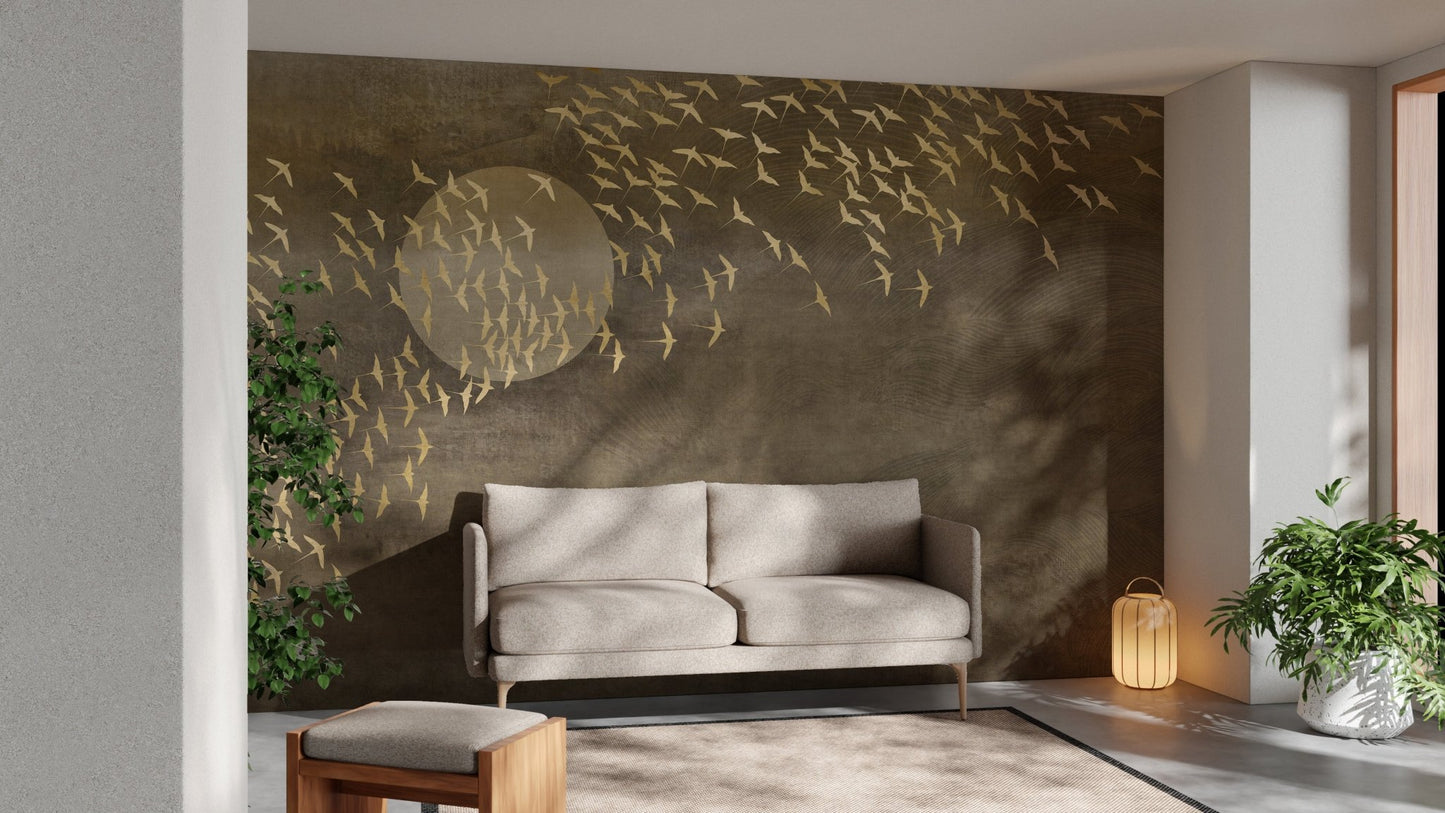 Golden Birds Flying in Sky Wall mural in a modern living room with grey sofa.