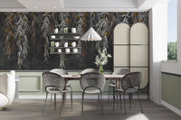 Contemporary dining space with leaves patterned wall mural and neutral tones.