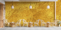 Metallic finish wallpaper mural in bold golden color.