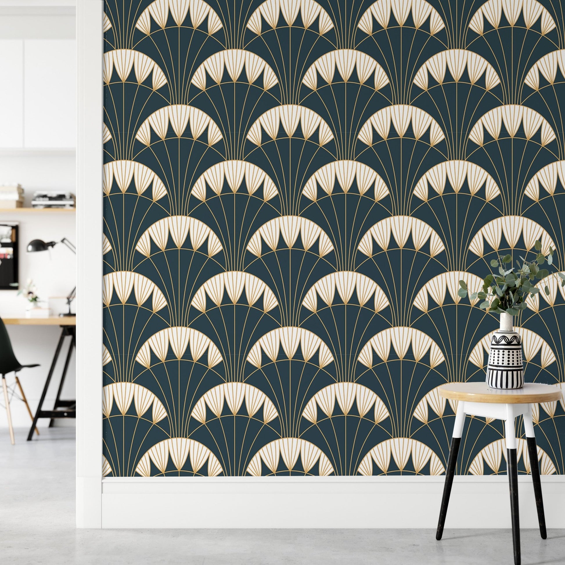 Symmetrical gold line wallpaper behind a minimalist office desk setup