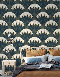 Dark green Art Deco wallpaper with repeating gold motifs in a bedroom
