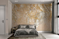 Neutral beige and gold tropical leaf print wall mural for large scale bedroom.