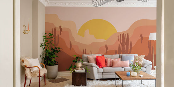 Warm color wallpaper showing stylized cactus scene and sunset glow.