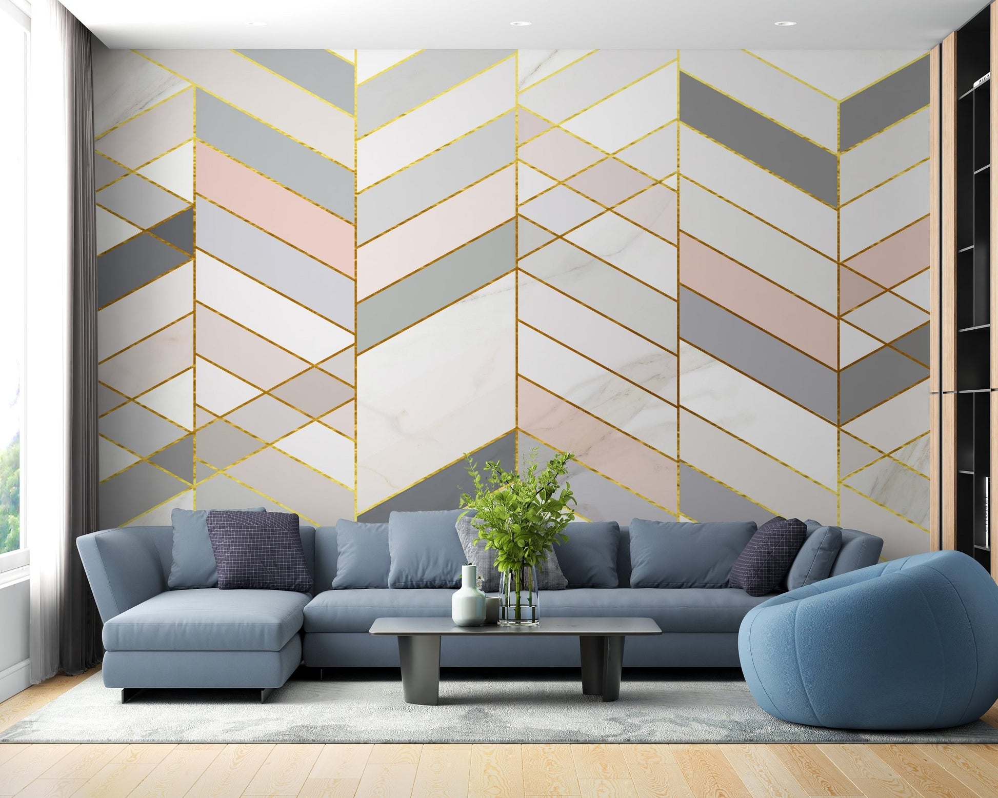 Living area with blue sectional sofa and marble geometric wall mural.