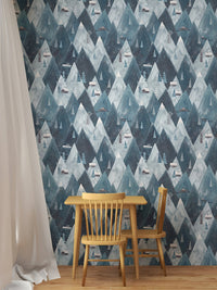 Scandinavian wallpaper featuring navy mountain peaks behind a wooden dining set.