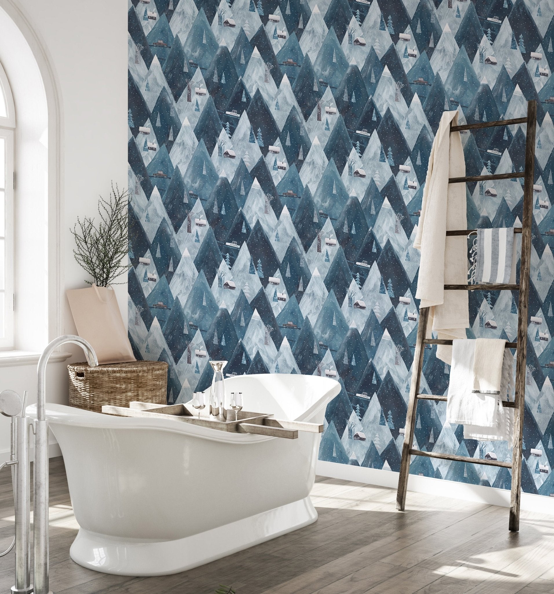 Waterproof mountain wallpaper in bathroom with white freestanding tub.