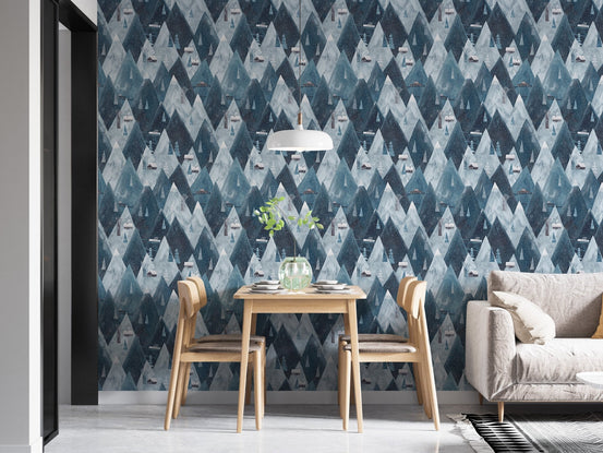 Blue and white mountain wallpaper in dining room with neutral sofa and table.