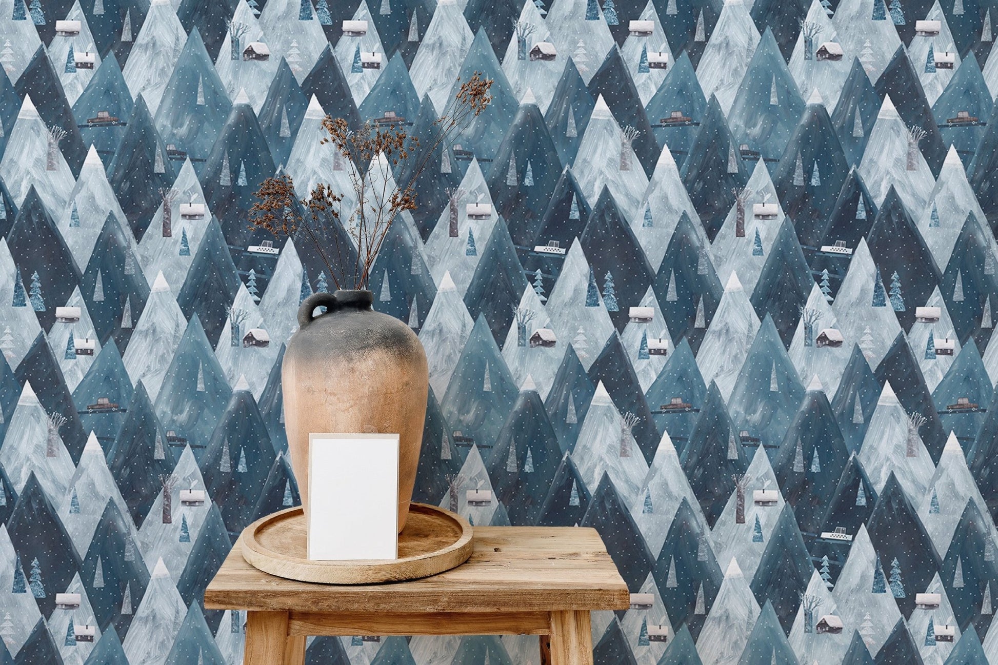 Textured mountain wallpaper with light wood furniture.