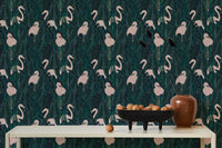 Minimalist console table styled against exotic bird pattern wallpaper.