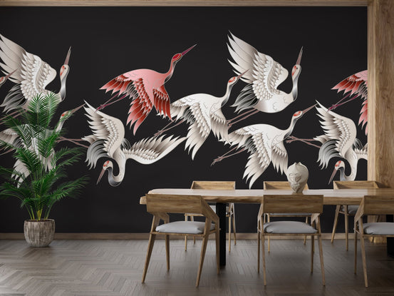 Flying cranes wall mural in a modern dining room with wooden furniture.