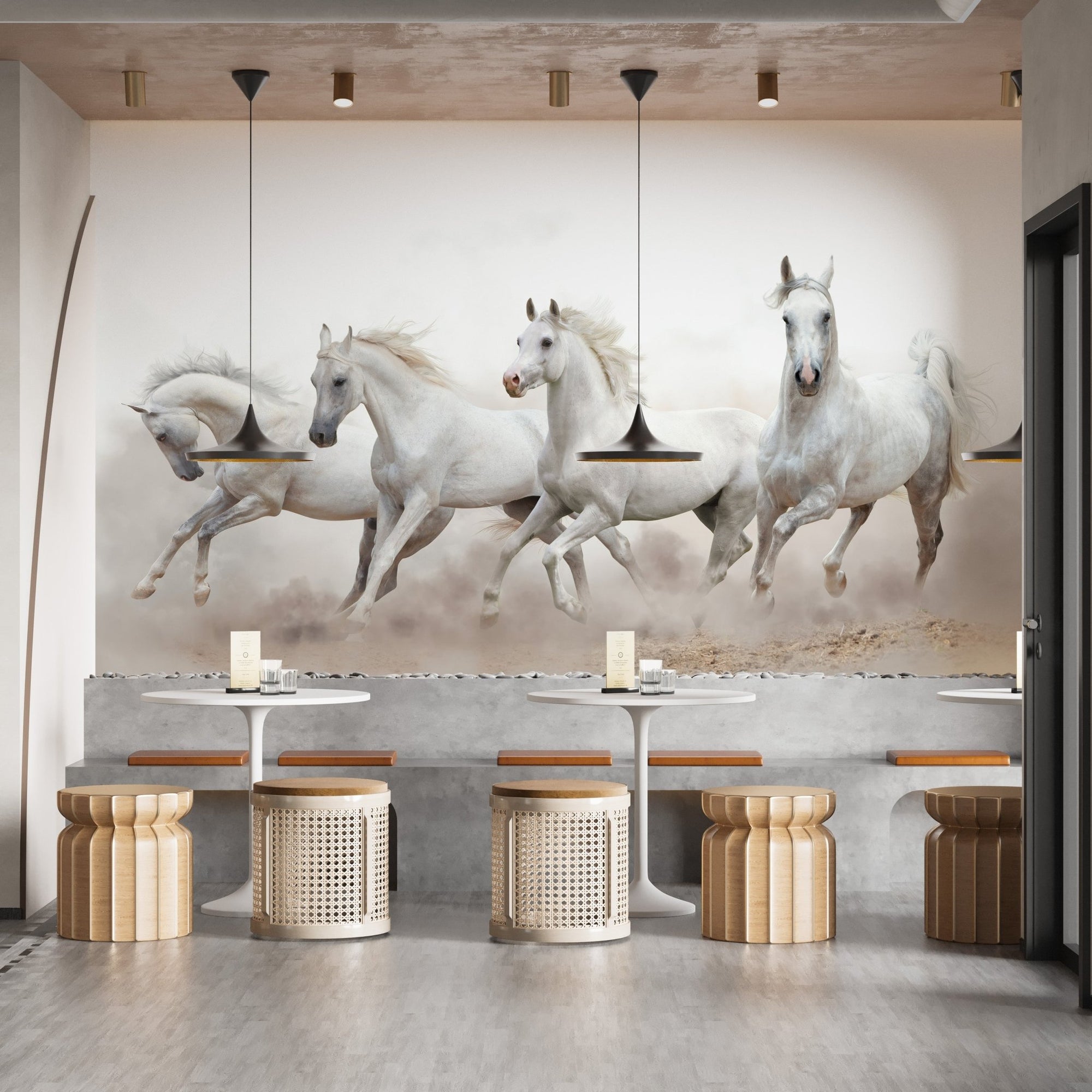 White running horses wall mural in a cafe with round tables and wooden stools.