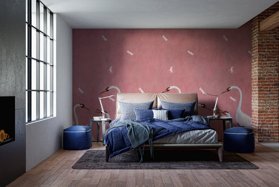 Graceful Sakura Soar Wall Mural in a bedroom with pink walls and white swan motifs.
