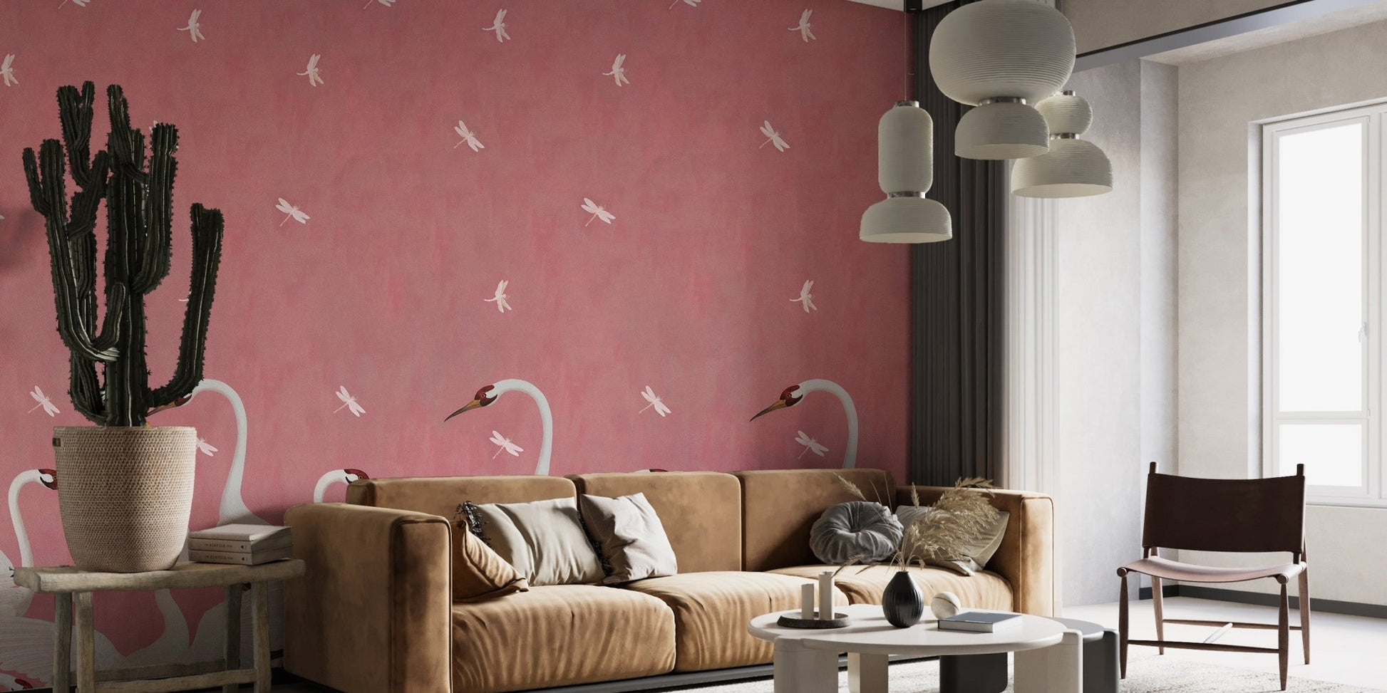 Pink soar pattern wall mural behind a brown leather sofa in a modern flat.