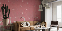 Pink soar pattern wall mural behind a brown leather sofa in a modern flat.